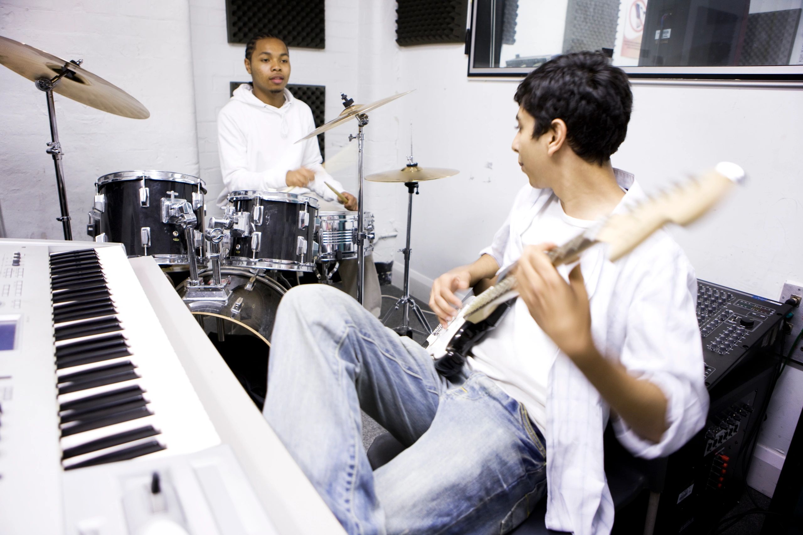 Music students learning together in a studio