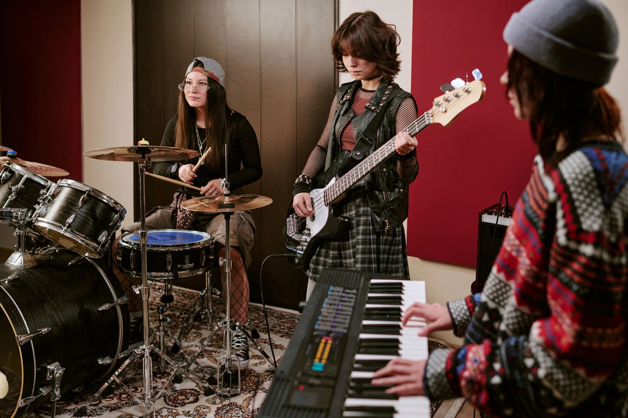 Young musicians rehearsing together in a studio