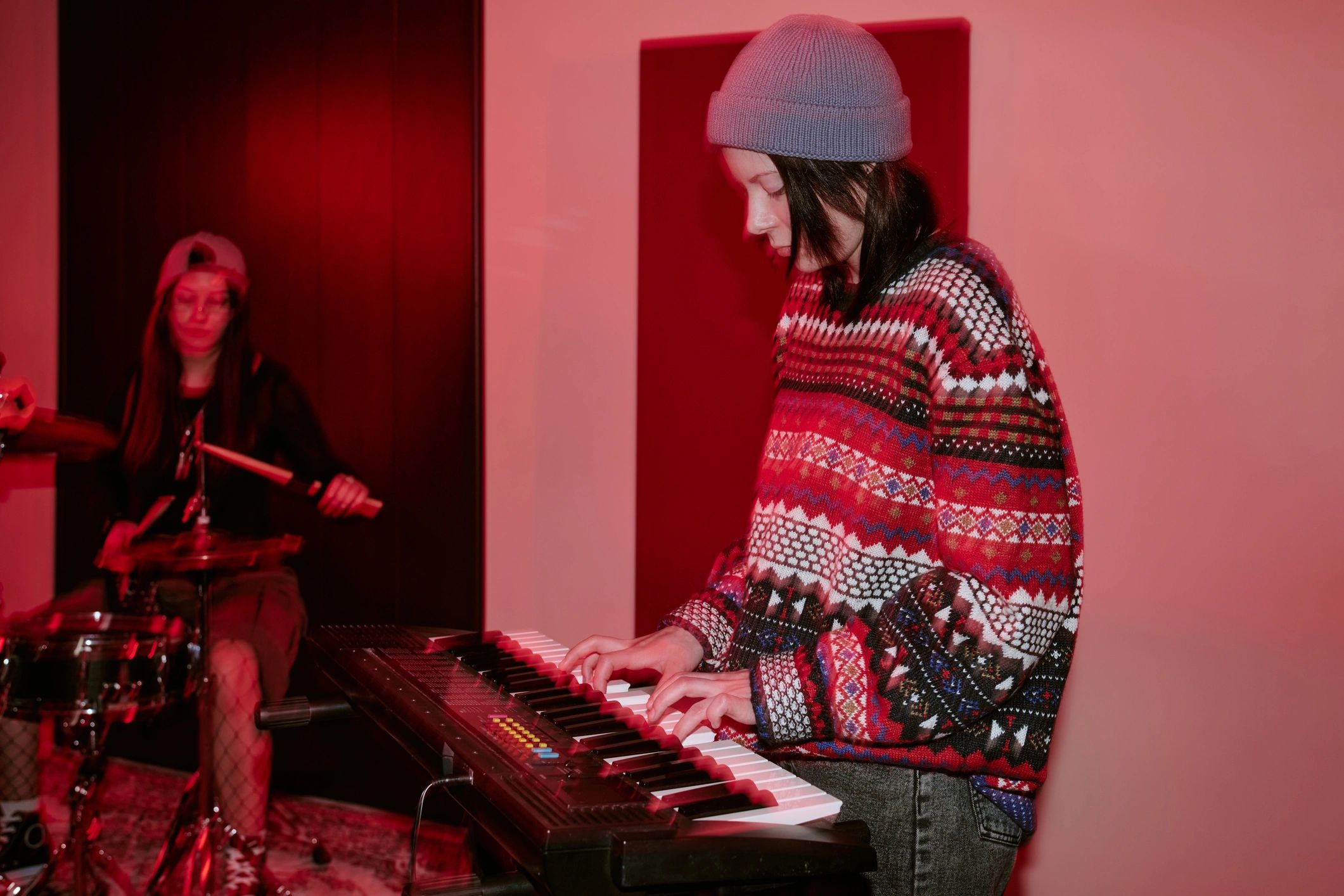 Students rehearsing music together in a studio